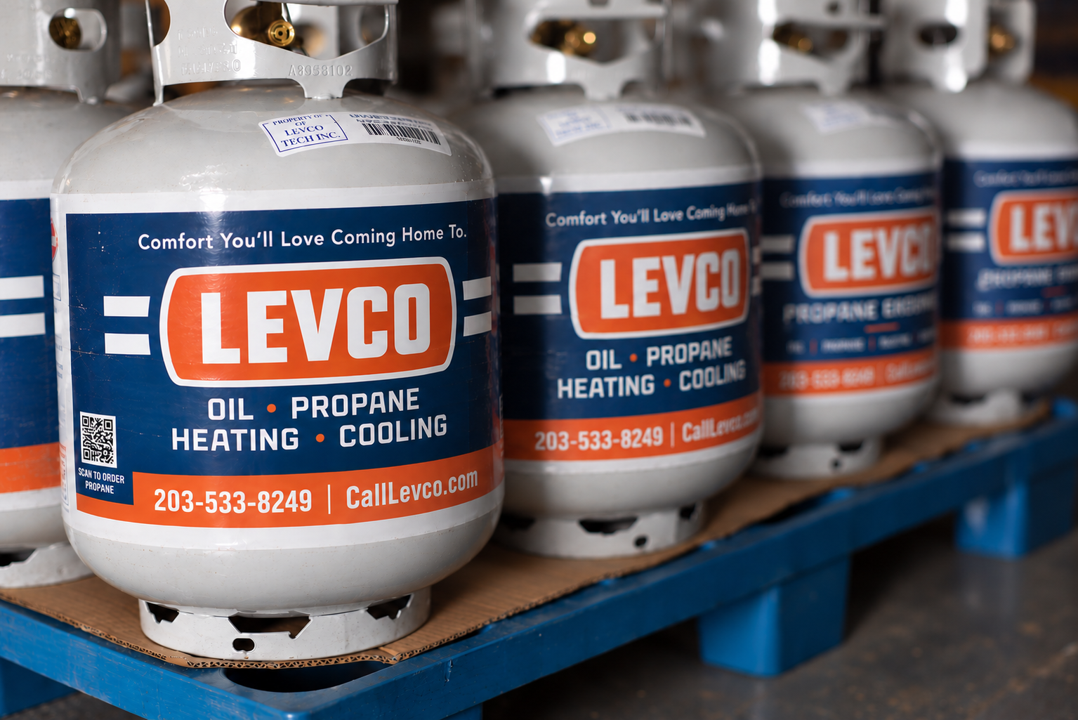Rows of Levco-branded 20-lb propane cylinders ready for delivery