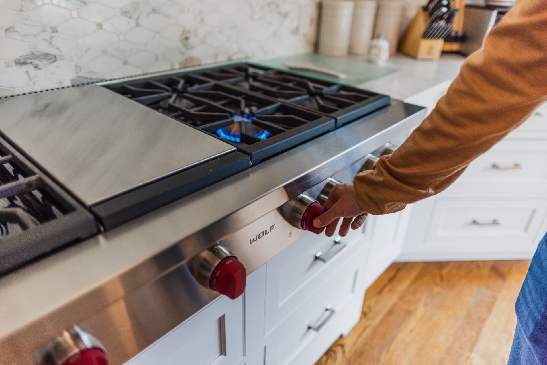 Blue propane flame burning on a residential kitchen range