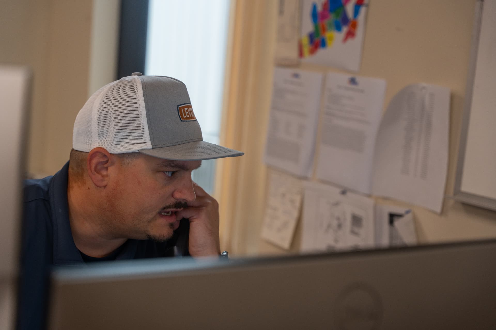 Levco team member discussing a homeowner's oil tank estimate by phone