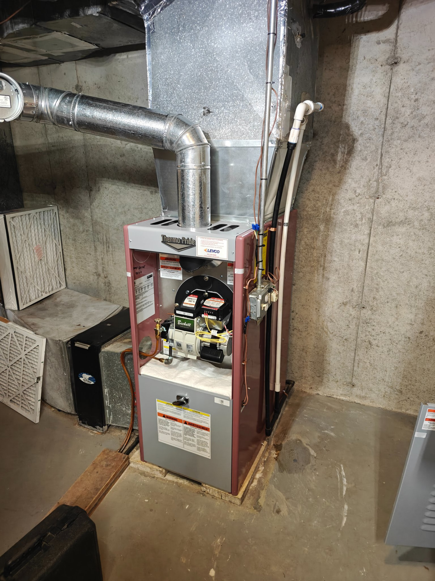 ThermoPride furnace opened for inspection after installation in a Connecticut basement