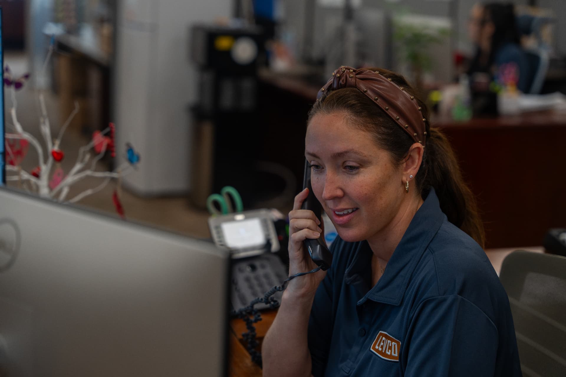 Levco team member taking a customer call at the Norwalk office